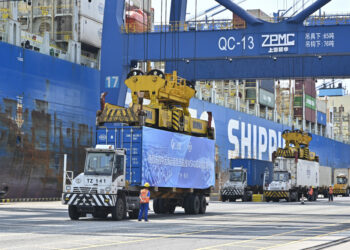 GUANGZHOU, CHINA - APRIL 29: Trucks transfer containers at Nansha Port on April 29, 2025 in Guangzhou, Guangdong Province of China. Guangzhou launched its first direct shipping route to the west coast of South America on April 29. The route will connect Guangzhou's Nansha Port with key ports in Latin America including Chancay Port in Peru, Manzanillo Port in Mexico and San Antonio Port in Chile. (Photo by Chen Jimin/China News Service/VCG via Getty Images)