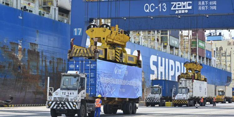 GUANGZHOU, CHINA - APRIL 29: Trucks transfer containers at Nansha Port on April 29, 2025 in Guangzhou, Guangdong Province of China. Guangzhou launched its first direct shipping route to the west coast of South America on April 29. The route will connect Guangzhou's Nansha Port with key ports in Latin America including Chancay Port in Peru, Manzanillo Port in Mexico and San Antonio Port in Chile. (Photo by Chen Jimin/China News Service/VCG via Getty Images)
