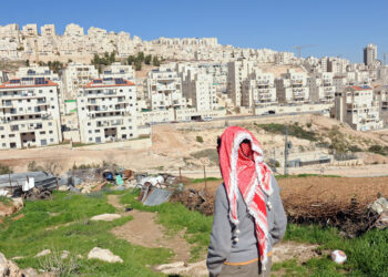 A Palestinian stands on his property overlooking the Israeli settlement Har Homa, West Bank, February 18, 2011. U.S. President Barack Obama called Palestinian President Mahmoud Abbas on Thursday in an attempt to prevent the upcoming vote on an United Nations resolution condemning Israeli settlements. The Palestinian Authority and other Arab nations have pushed for the UN Security Council to vote on the resolution which is scheduled to take place today.  UPI/Debbie Hill