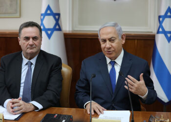 Israeli Prime Minister Benjamin Netanyahu (R) speaks as he sits next to Minister of Transport and Minister of Foreign Affairs Israel Katz during the weekly cabinet meeting at his office in Jerusalem, on February 24, 2019. (Photo by ABIR SULTAN / POOL / AFP)        (Photo credit should read ABIR SULTAN/AFP via Getty Images)