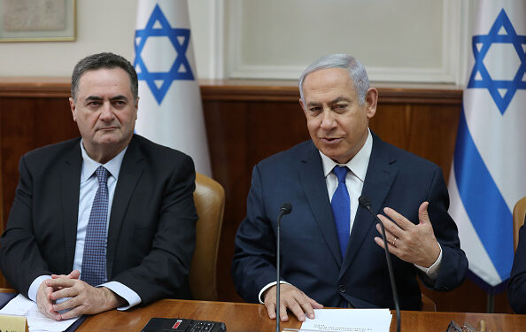 Israeli Prime Minister Benjamin Netanyahu (R) speaks as he sits next to Minister of Transport and Minister of Foreign Affairs Israel Katz during the weekly cabinet meeting at his office in Jerusalem, on February 24, 2019. (Photo by ABIR SULTAN / POOL / AFP)        (Photo credit should read ABIR SULTAN/AFP via Getty Images)