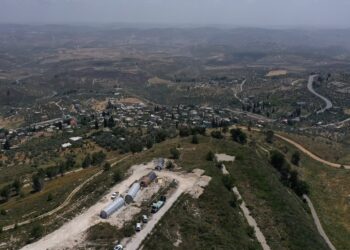 An aerial view shows the Israeli settler outpost of Homesh (C-bottom), near the Palestinian village of Burqah, in the occupied West Bank, on May 29, 2023. - Israeli settlers started reviving the flashpoint outpost settlement in the occupied West Bank on May 29, which had been evacuated nearly two decades prior, constructing a building at the site which has drawn international attention. The latest development comes weeks after the office of Prime Minister Benjamin Netanyahu pledged his government had no plans to reconstruct the site, after a parliamentary vote on the matter sparked ire abroad. (Photo by Menahem KAHANA / AFP)