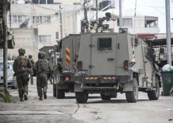 NABLUS, WEST BANK, PALESTINE - 2026/02/26: Israeli soldiers take up positions during a military operation. Israeli forces surrounded a Palestinian home in West Bank city of Nablus during a military operation in the Halawa neighborhood of Nablus. (Photo by Nasser Ishtayeh/SOPA Images/LightRocket via Getty Images)