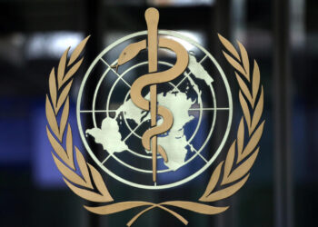 FILE PHOTO: FILE PHOTO: A logo is pictured on the headquarters of the World Health Organization (WHO) ahead of a meeting of the Emergency Committee on the novel coronavirus (2019-nCoV) in Geneva, Switzerland, January 30, 2020. REUTERS/Denis Balibouse/File Photo