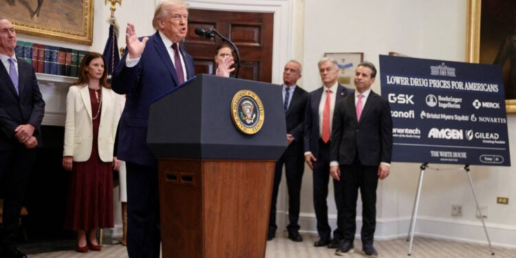 FILE PHOTO: U.S. President Donald Trump gestures as he makes an announcement about lowering the cost of drug prices, at the Roosevelt Room of the White House in Washington, D.C., U.S., December 19, 2025. REUTERS/Evelyn Hockstein/File Photo