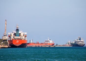 The Nicos I.V. oil tanker (R), sailing under the flag of Saint Vincent and the Grenadines, is seen alongside other tanker vessels in the port of Matanzas, Cuba, on February 17, 2026. (Photo by AFP)